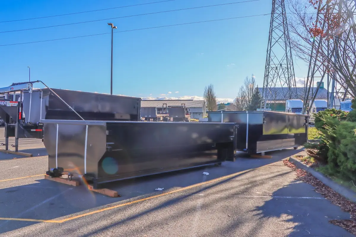 Roll-off dumpster ready for waste disposal at job site for 12 Yard Dumpster Rental in Monroe